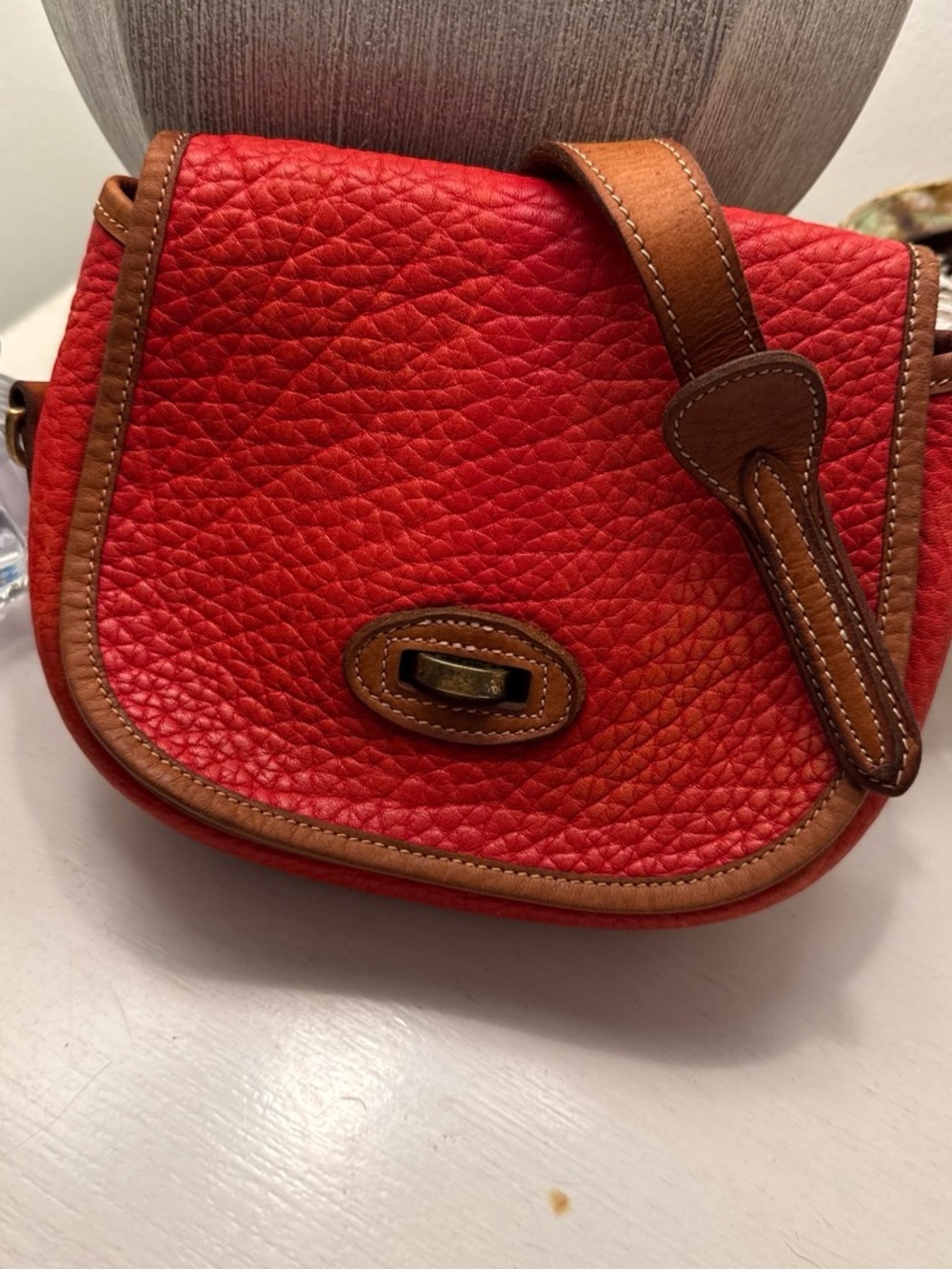 Red Pebbled Leather Saddle Bag with Tan Trim